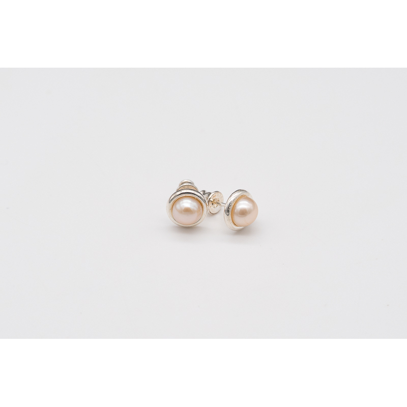 Apricot freshwater pearl studs with silver bezel setting