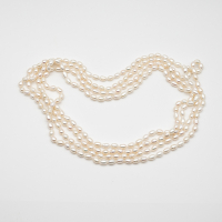 Long white freshwater pearl necklace with rice-shaped pearls 