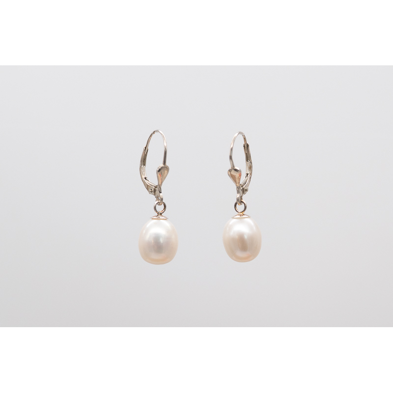 White oval freshwater pearl earrings with lever-back closure