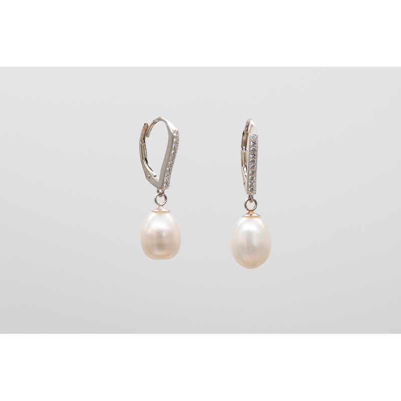 White oval freshwater pearl earrings with silver hooks