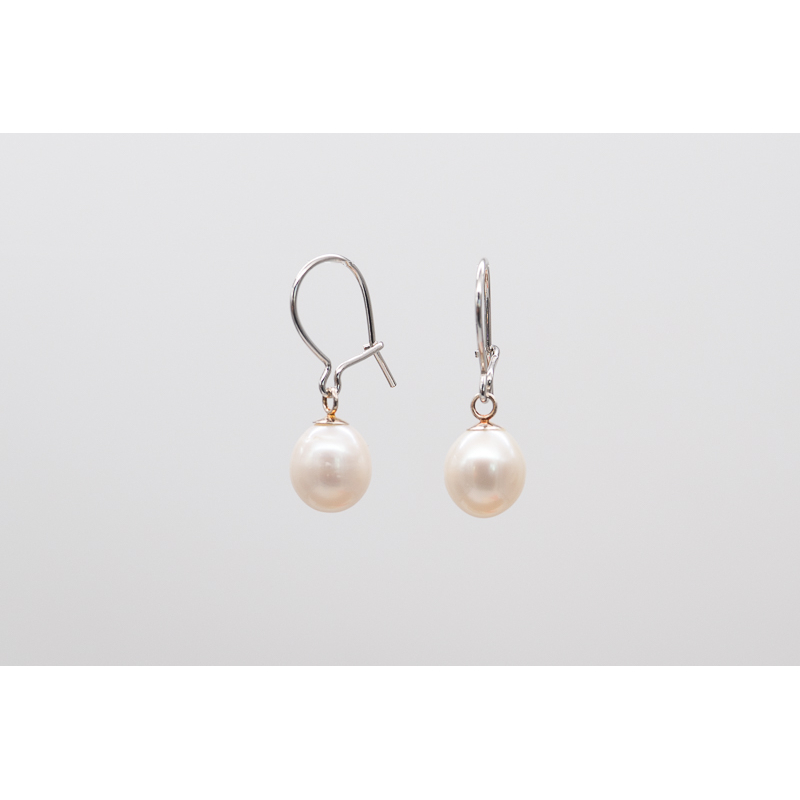 White oval freshwater pearl earrings with silver hooks