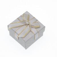 The cream-colored gift box